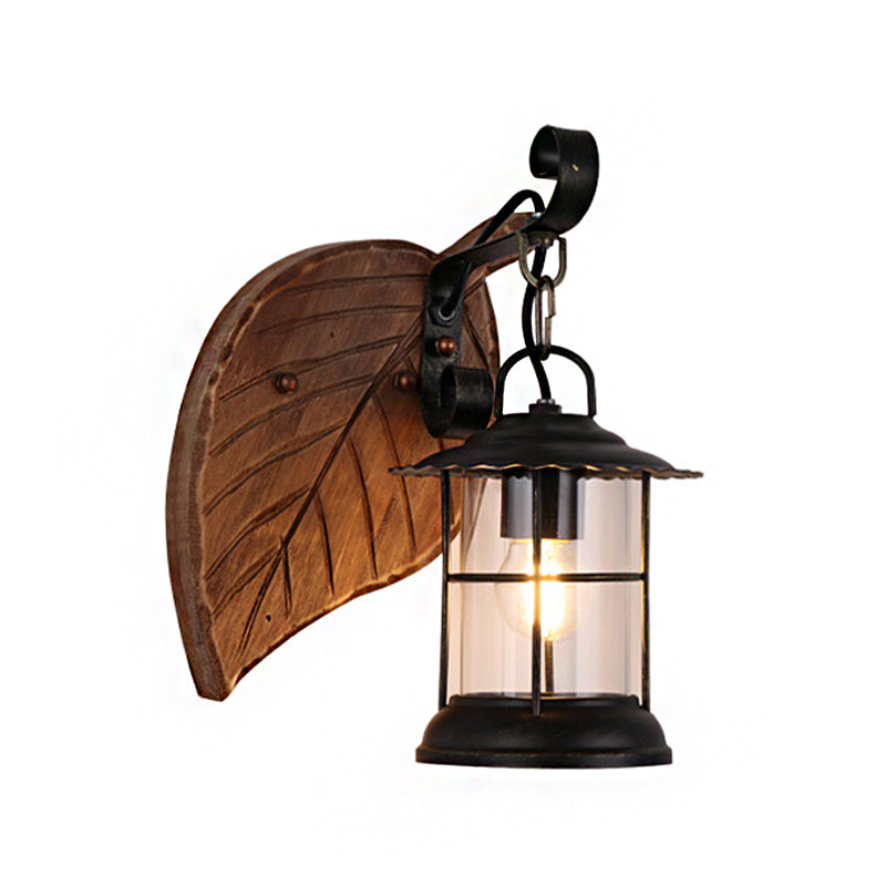 Kerosene Dining Room Wall Lighting Fixture Antiqued Clear Glass 1-Head Brown Sconce with Wood Leaf/Key Backplate Clearhalo 'Art deco wall lights' 'Cast Iron' 'Glass' 'Industrial wall lights' 'Industrial' 'Middle century wall lights' 'Modern' 'Rustic wall lights' 'Tiffany' 'Traditional wall lights' 'Wall Lamps & Sconces' 'Wall Lights' Lighting' 1043871