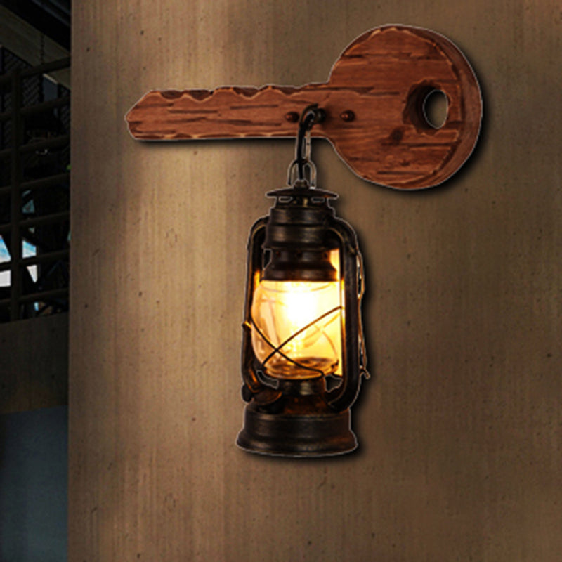 Kerosene Dining Room Wall Lighting Fixture Antiqued Clear Glass 1-Head Brown Sconce with Wood Leaf/Key Backplate Clearhalo 'Art deco wall lights' 'Cast Iron' 'Glass' 'Industrial wall lights' 'Industrial' 'Middle century wall lights' 'Modern' 'Rustic wall lights' 'Tiffany' 'Traditional wall lights' 'Wall Lamps & Sconces' 'Wall Lights' Lighting' 1043878