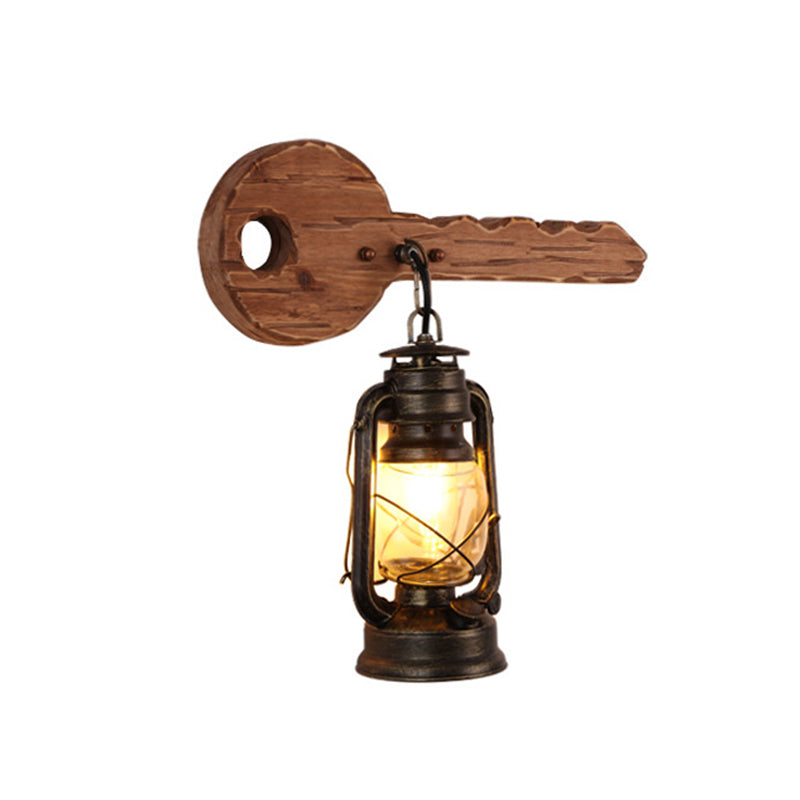 Kerosene Dining Room Wall Lighting Fixture Antiqued Clear Glass 1-Head Brown Sconce with Wood Leaf/Key Backplate Clearhalo 'Art deco wall lights' 'Cast Iron' 'Glass' 'Industrial wall lights' 'Industrial' 'Middle century wall lights' 'Modern' 'Rustic wall lights' 'Tiffany' 'Traditional wall lights' 'Wall Lamps & Sconces' 'Wall Lights' Lighting' 1043880