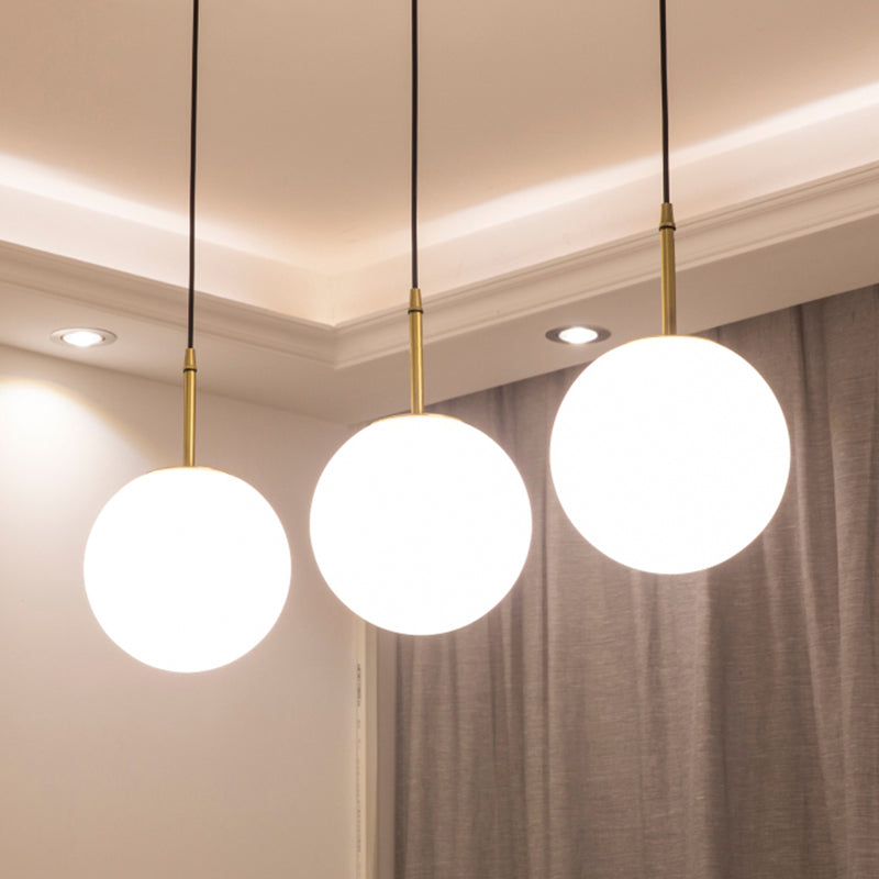One Light Round Ceiling Pendant Light Modern Brass White Glass Hanging Lamp for Dining Room, 6"/8" Wide White 8" Clearhalo 'Art Deco Pendants' 'Cast Iron' 'Ceiling Lights' 'Ceramic' 'Crystal' 'Industrial Pendants' 'Industrial' 'Metal' 'Middle Century Pendants' 'Pendant Lights' 'Pendants' 'Tiffany' Lighting' 139843