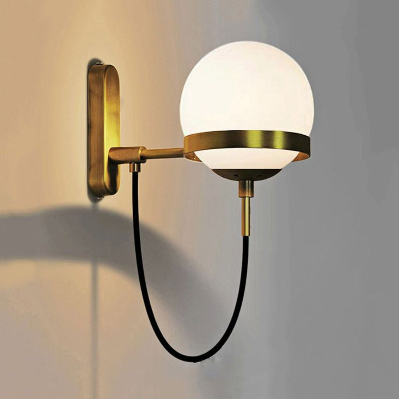 Black/Gold Globe Wall Lighting Modern Clear/Frosted Glass 1 Light Living Room Sconce Light Fixture Clearhalo 'Art deco wall lights' 'Cast Iron' 'Glass' 'Industrial wall lights' 'Industrial' 'Middle century wall lights' 'Modern' 'Rustic wall lights' 'Tiffany' 'Traditional wall lights' 'Wall Lamps & Sconces' 'Wall Lights' Lighting' 1420590