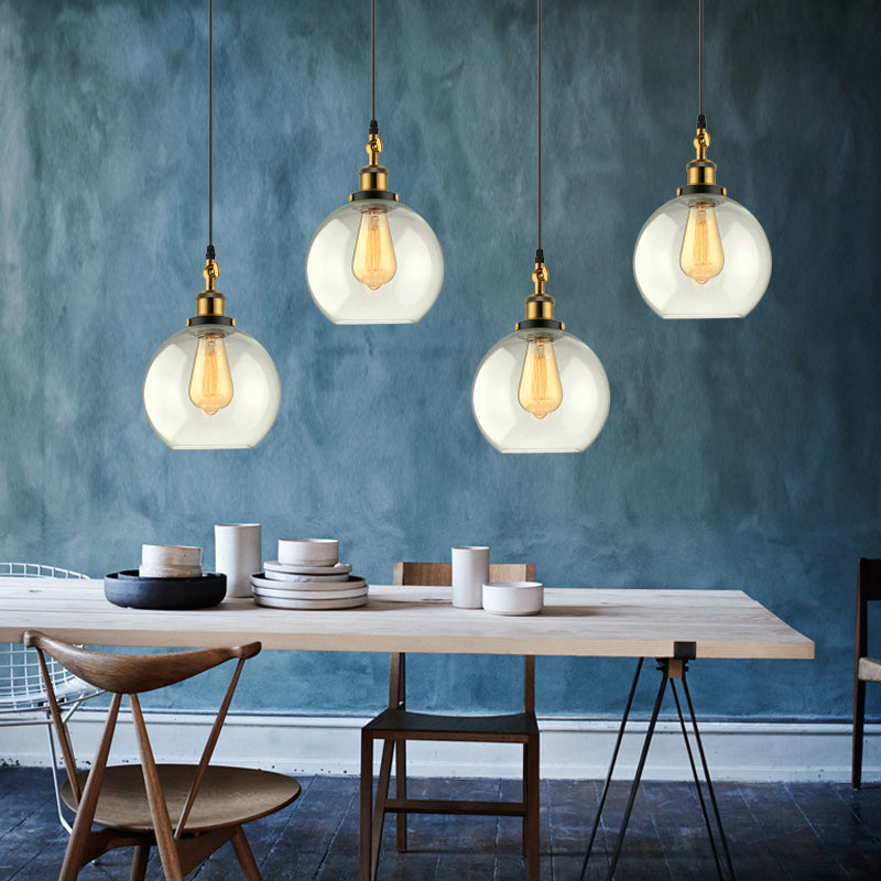 3/4-Light Clear Glass Multi Hanging Light Fixture Industrial Antique Brass Orb Living Room Pendant with Round Canopy 4 Clear Clearhalo 'Ceiling Lights' 'Glass shade' 'Glass' 'Industrial Pendants' 'Industrial' 'Middle Century Pendants' 'Pendant Lights' 'Pendants' 'Tiffany' Lighting' 159517