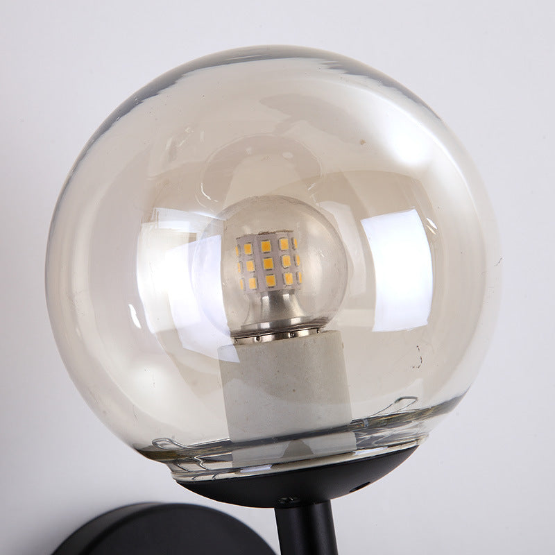 Black/Gold Round Wall Lighting Modern Clear Glass 1 Light Bedroom Sconce Light Fixture Clearhalo 'Cast Iron' 'Glass' 'Industrial wall lights' 'Industrial' 'Middle century wall lights' 'Modern' 'Tiffany' 'Traditional wall lights' 'Wall Lamps & Sconces' 'Wall Lights' Lighting' 164703