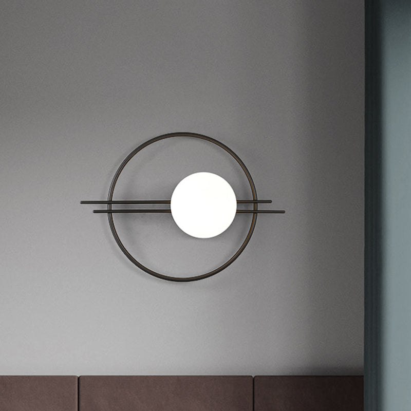 Circle Lounge Sconce Light Iron 1 Head Postmodern Wall Mounted Lighting in Black/Brass with Ball White Glass Shade Clearhalo 'Cast Iron' 'Glass' 'Industrial' 'Modern wall lights' 'Modern' 'Tiffany' 'Traditional wall lights' 'Wall Lamps & Sconces' 'Wall Lights' Lighting' 1788577
