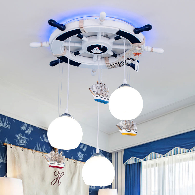 Globe Down Lighting Nautical Opaque Glass 3 Heads Nursery Multiple Lamp Pendant with Rudder Canopy in White Clearhalo 'Ceiling Lights' 'Close To Ceiling Lights' 'Glass shade' 'Glass' 'Pendant Lights' 'Pendants' Lighting' 1907768