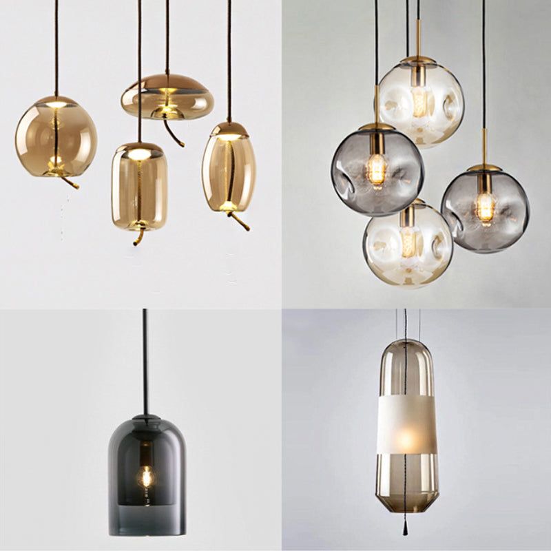 Dimpled Sphere Ceiling Pendant Modern Cognac/Smoke Grey Glass 1 Head Brass Hanging Light Fixture for Living Room Clearhalo 'Ceiling Lights' 'Glass shade' 'Glass' 'Modern Pendants' 'Modern' 'Pendant Lights' 'Pendants' Lighting' 1937202