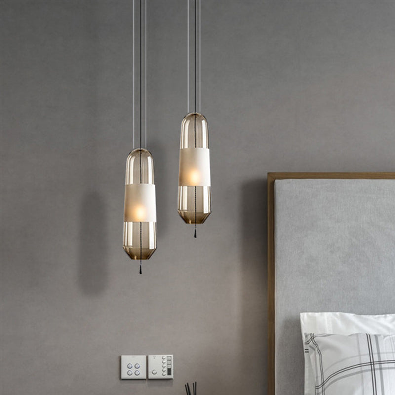 1 Bulb Bedroom Down Lighting Postmodern Black Hanging Pendant with Capsule Clear/Smoke/Amber Glass Shade Clearhalo 'Ceiling Lights' 'Glass shade' 'Glass' 'Modern Pendants' 'Modern' 'Pendant Lights' 'Pendants' Lighting' 1937237