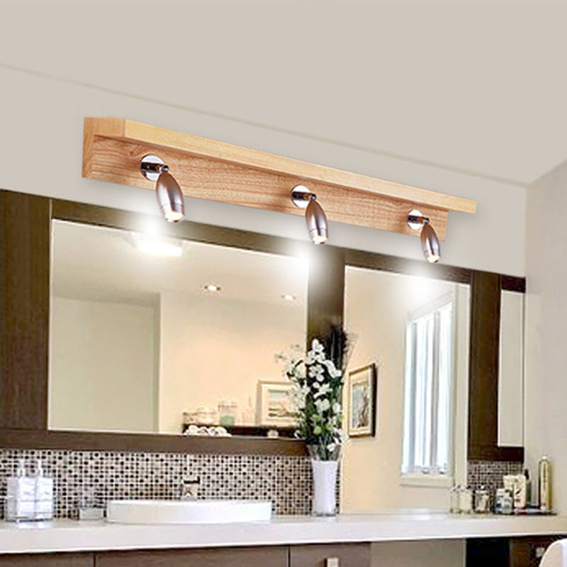 Bullet Shaped Rotating Vanity Light Modern Metal 3 Lights Wood Wall Lighting in Warm/White Light Clearhalo 'Modern wall lights' 'Modern' 'Vanity Lights' 'Wall Lights' Lighting' 1949198