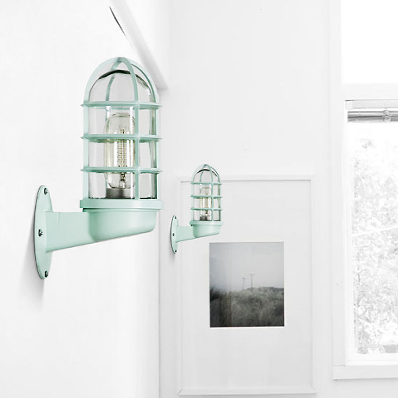 Loft Capsule Wall Lamp Fixture Single Transparent Glass Sconce Light with Wire Cage in Pink/Blue/Rust Green Clearhalo 'Art deco wall lights' 'Cast Iron' 'Glass' 'Industrial wall lights' 'Industrial' 'Middle century wall lights' 'Modern' 'Rustic wall lights' 'Tiffany' 'Traditional wall lights' 'Wall Lamps & Sconces' 'Wall Lights' Lighting' 1969637
