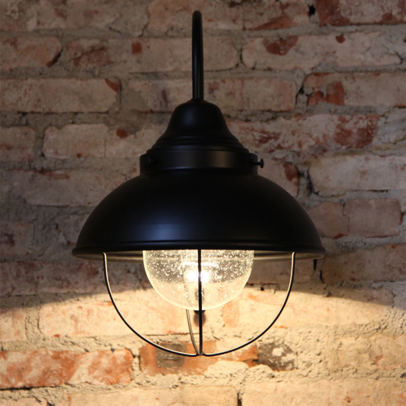 Cone Seeded Glass Wall Light Industrial One Bulb Outdoor Sconce Lighting Fixture in Black with Cage Black Clearhalo 'Art deco wall lights' 'Cast Iron' 'Glass' 'Industrial wall lights' 'Industrial' 'Middle century wall lights' 'Modern' 'Rustic wall lights' 'Tiffany' 'Traditional wall lights' 'Wall Lamps & Sconces' 'Wall Lights' Lighting' 205320