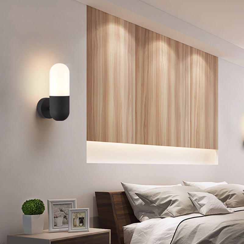 Capsule Metal Wall Sconce Light Postmodern 1 Light Black/Gray/White Wall Mounted Light for Bedroom Black Clearhalo 'Cast Iron' 'Glass' 'Industrial' 'Modern wall lights' 'Modern' 'Tiffany' 'Traditional wall lights' 'Wall Lamps & Sconces' 'Wall Lights' Lighting' 210799