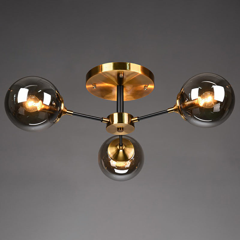 Black and Brass Radial Flush Mount Lighting Postmodern Metal Semi Flush Ceiling Light with Ball Glass Shade 3 Smoke Gray Clearhalo 'Ceiling Lights' 'Close To Ceiling Lights' 'Close to ceiling' 'Semi-flushmount' Lighting' 2354106