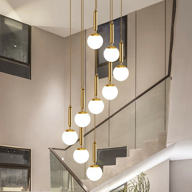 Minimalist Ball Pendant Lighting White Glass Stairway Multi Hanging Light Fixture in Gold Clearhalo 'Art Deco Pendants' 'Cast Iron' 'Ceiling Lights' 'Ceramic' 'Crystal' 'Industrial Pendants' 'Industrial' 'Metal' 'Middle Century Pendants' 'Modern Pendants' 'Modern' 'Pendant Lights' 'Pendants' 'Tiffany' Lighting' 2385131