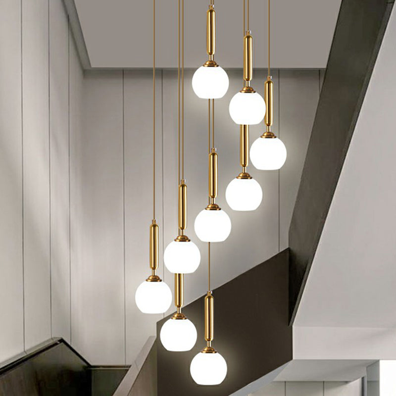 Minimalist Ball Pendant Lighting White Glass Stairway Multi Hanging Light Fixture in Gold 9 Gold Cylinder Clearhalo 'Art Deco Pendants' 'Cast Iron' 'Ceiling Lights' 'Ceramic' 'Crystal' 'Industrial Pendants' 'Industrial' 'Metal' 'Middle Century Pendants' 'Modern Pendants' 'Modern' 'Pendant Lights' 'Pendants' 'Tiffany' Lighting' 2385132