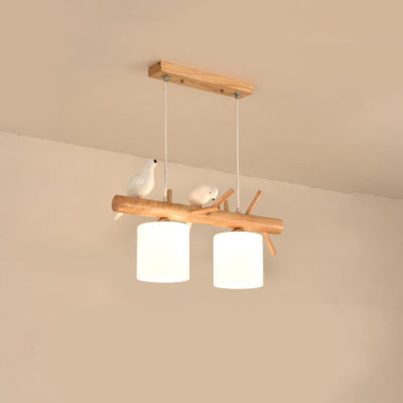 Opal Glass Cylinder Pendant Light Nordic Wood Island Light with Resin Bird Decor 2 Wood Clearhalo 'Ceiling Lights' 'Island Lights' Lighting' 2460560