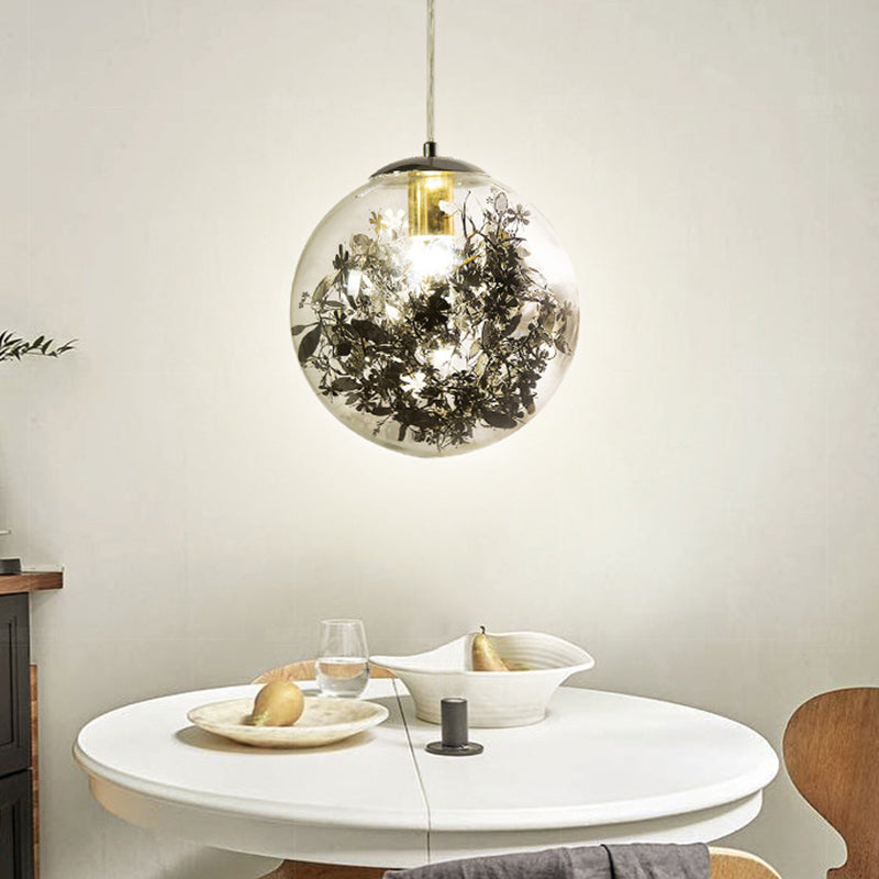 Globe Suspension Lighting Simple Clear Glass 1-Head Dining Room Pendant Light with Foil Flower Inside Black Clearhalo 'Ceiling Lights' 'Close To Ceiling Lights' 'Glass shade' 'Glass' 'Modern Pendants' 'Modern' 'Pendant Lights' 'Pendants' Lighting' 2461757