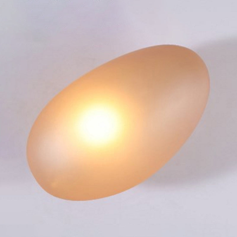 Frosted Glass Cobblestone Wall Sconce Art Deco 1-Light Wall Mount Light for Living Room Amber Oval Clearhalo 'Cast Iron' 'Glass' 'Industrial' 'Modern wall lights' 'Modern' 'Tiffany' 'Traditional wall lights' 'Wall Lamps & Sconces' 'Wall Lights' Lighting' 2467038