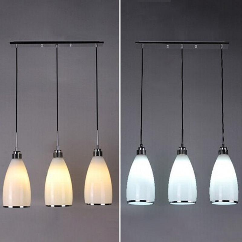 Satin Opal Glass Cluster Bell Pendant Minimalist 3-Light Chrome Suspension Light for Dining Room Clearhalo 'Ceiling Lights' 'Modern Pendants' 'Modern' 'Pendant Lights' 'Pendants' Lighting' 2593024