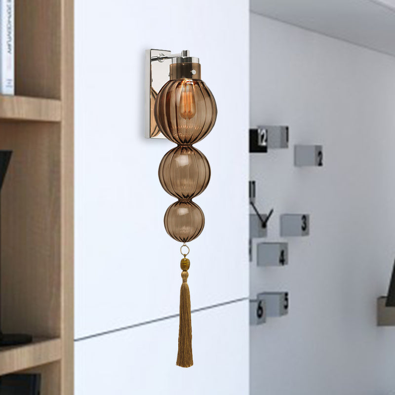 Brass/Chrome Finish Sphere Sconce Light Chinese Style 1 Bulb Clear/Amber/Light Blue Glass Wall Mount Lamp with Tassel Knot Chrome Amber Clearhalo 'Cast Iron' 'Glass' 'Industrial' 'Modern wall lights' 'Modern' 'Tiffany' 'Traditional wall lights' 'Wall Lamps & Sconces' 'Wall Lights' Lighting' 273069