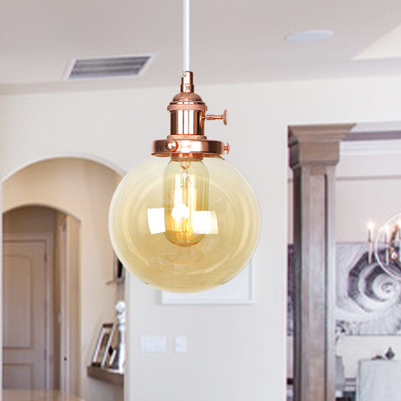Orbit Hanging Lighting Farmhouse Amber/Clear Glass 1 Bulb Pendant Light Fixture with Adjustable Cord in Black/Bronze/Brass Finish Rose Gold Amber Clearhalo 'Art Deco Pendants' 'Black' 'Cast Iron' 'Ceiling Lights' 'Ceramic' 'Crystal' 'Industrial Pendants' 'Industrial' 'Metal' 'Middle Century Pendants' 'Pendant Lights' 'Pendants' 'Rustic Pendants' 'Tiffany' Lighting' 273885