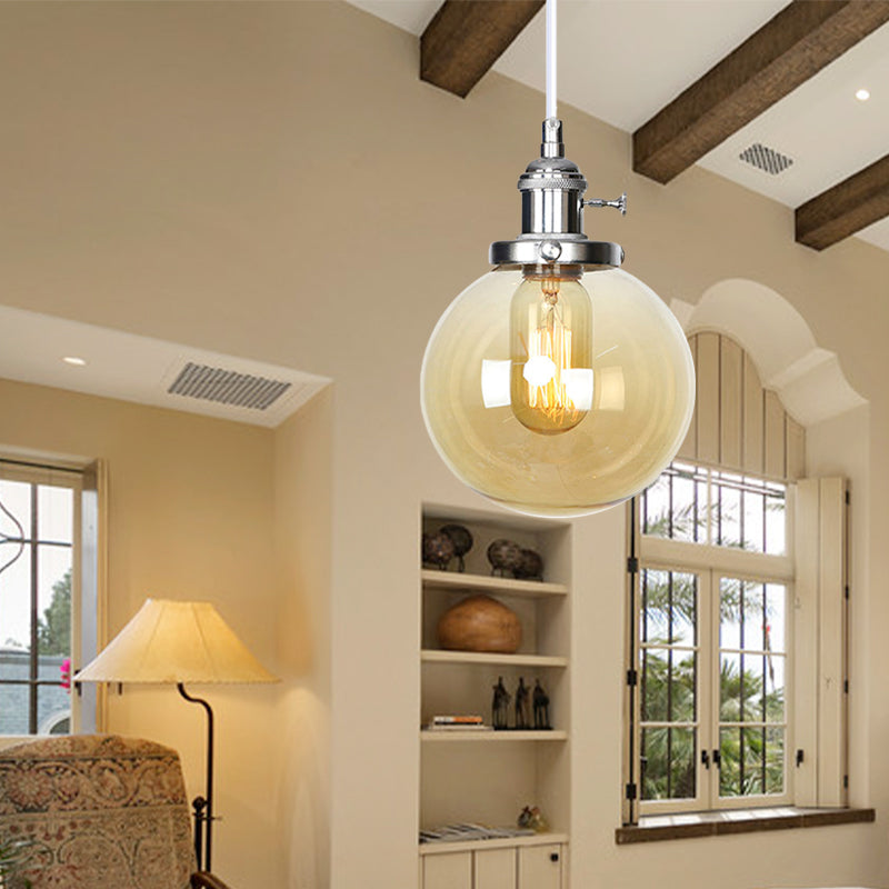 Orbit Hanging Lighting Farmhouse Amber/Clear Glass 1 Bulb Pendant Light Fixture with Adjustable Cord in Black/Bronze/Brass Finish Clearhalo 'Art Deco Pendants' 'Black' 'Cast Iron' 'Ceiling Lights' 'Ceramic' 'Crystal' 'Industrial Pendants' 'Industrial' 'Metal' 'Middle Century Pendants' 'Pendant Lights' 'Pendants' 'Rustic Pendants' 'Tiffany' Lighting' 273900
