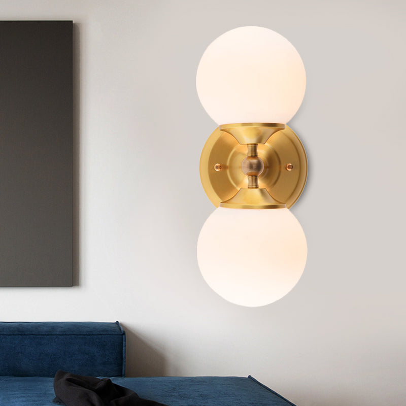Spherical Sconce Contemporary Milky Glass 2 Heads Wall Mount Light Fixture in Brass Clearhalo 'Cast Iron' 'Glass' 'Industrial' 'Modern wall lights' 'Modern' 'Tiffany' 'Traditional wall lights' 'Wall Lamps & Sconces' 'Wall Lights' Lighting' 324227