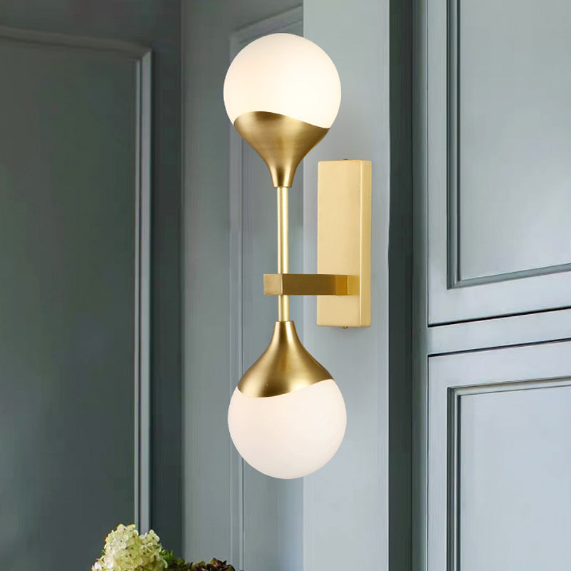 Modernist 2 Heads Wall Lighting Brass Global Sconce Light Fixture with Opal Glass Shade Clearhalo 'Cast Iron' 'Glass' 'Industrial' 'Modern wall lights' 'Modern' 'Tiffany' 'Traditional wall lights' 'Wall Lamps & Sconces' 'Wall Lights' Lighting' 324236