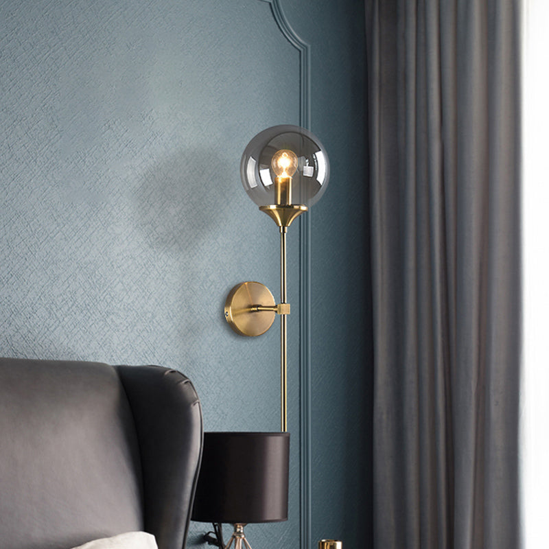 Modernist Round Wall Lamp Clear/Amber/Smoke Gray Glass 1 Bulb Bedside Sconce Light Fixture with Metal Pencil Arm Clearhalo 'Cast Iron' 'Glass' 'Industrial' 'Modern wall lights' 'Modern' 'Tiffany' 'Traditional wall lights' 'Wall Lamps & Sconces' 'Wall Lights' Lighting' 325679