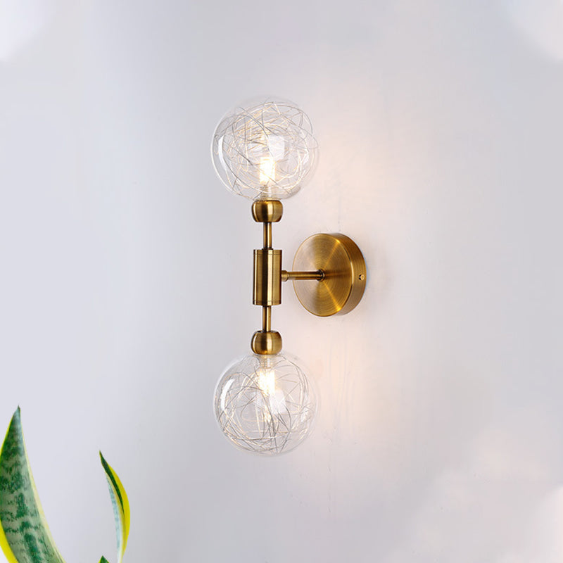 1/2-Light Bedroom Sconce Wall Light Industrial Style Black/Brass Finish Wall Lamp with Orbit Clear Glass Shade 2.0 Brass Clearhalo 'Art deco wall lights' 'Cast Iron' 'Glass' 'Industrial wall lights' 'Industrial' 'Middle century wall lights' 'Modern' 'Rustic wall lights' 'Tiffany' 'Traditional wall lights' 'Wall Lamps & Sconces' 'Wall Lights' Lighting' 331680