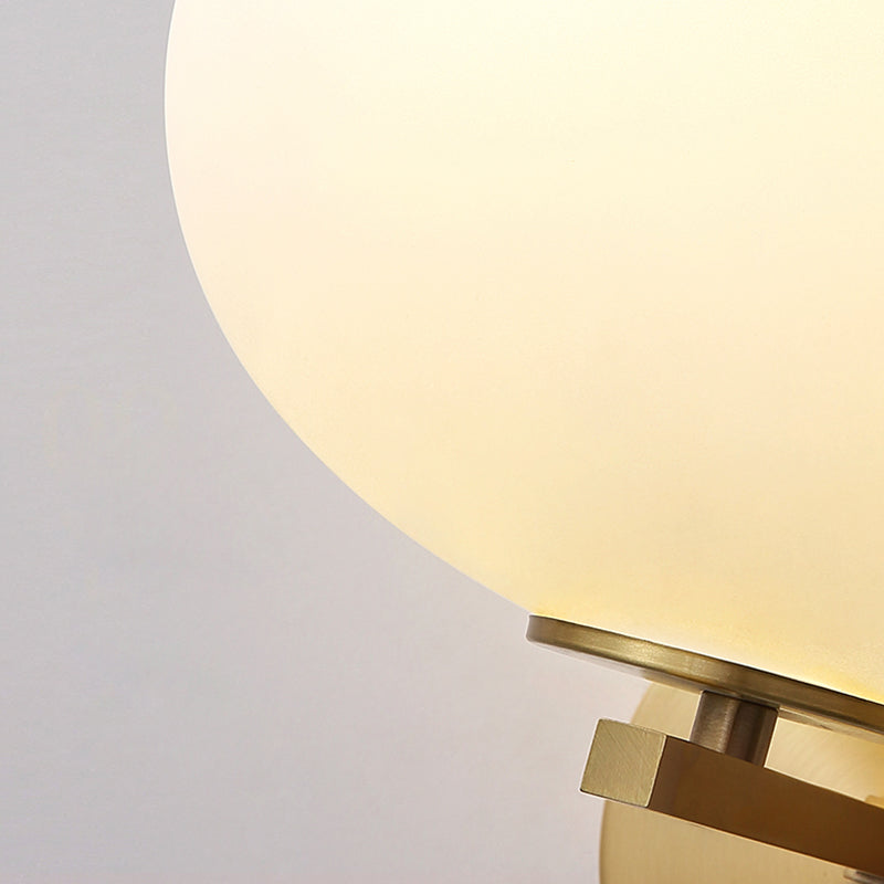 Milk Glass Oval Wall Mount Lamp Modern 1 Light Bedside Wall Sconce Light in Brass Clearhalo 'Cast Iron' 'Glass' 'Industrial' 'Modern wall lights' 'Modern' 'Tiffany' 'Traditional wall lights' 'Vanity Lights' 'Wall Lights' Lighting' 370189