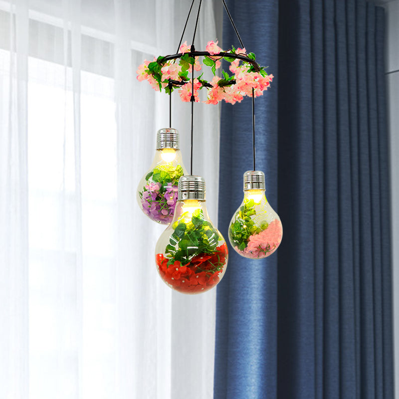 Clear Glass Bulb Cluster Pendant Industrial 3 Lights Restaurant LED Ceiling Lamp in Black with Flower Decoration Clearhalo 'Ceiling Lights' 'Glass shade' 'Glass' 'Industrial Pendants' 'Industrial' 'Middle Century Pendants' 'Pendant Lights' 'Pendants' 'Tiffany' Lighting' 401004