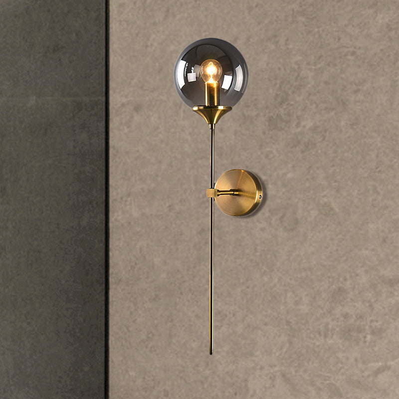 Modern Globe Shade Wall Lighting Single Bulb Clear/Grey/Amber Glass Sconce Light in Brass for Bedroom Clearhalo 'Art deco wall lights' 'Cast Iron' 'Glass' 'Industrial wall lights' 'Industrial' 'Middle century wall lights' 'Modern' 'Rustic wall lights' 'Tiffany' 'Traditional wall lights' 'Wall Lamps & Sconces' 'Wall Lights' Lighting' 460708