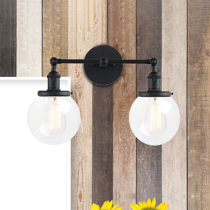 Round Living Room Wall Light Fixture Industrial Clear Glass 2-Light Black/Brass Sconce Lamp for Study Room Clearhalo 'Cast Iron' 'Glass' 'Industrial wall lights' 'Industrial' 'Middle century wall lights' 'Modern' 'Tiffany' 'Traditional wall lights' 'Wall Lamps & Sconces' 'Wall Lights' Lighting' 467743