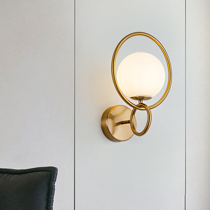 Ring Iron Wall Mount Lighting Post Modern 1-Bulb Brass Finish Wall Lamp Sconce with Ball Opal Glass Shade Brass Clearhalo 'Cast Iron' 'Glass' 'Industrial' 'Modern wall lights' 'Modern' 'Tiffany' 'Traditional wall lights' 'Wall Lamps & Sconces' 'Wall Lights' Lighting' 520726