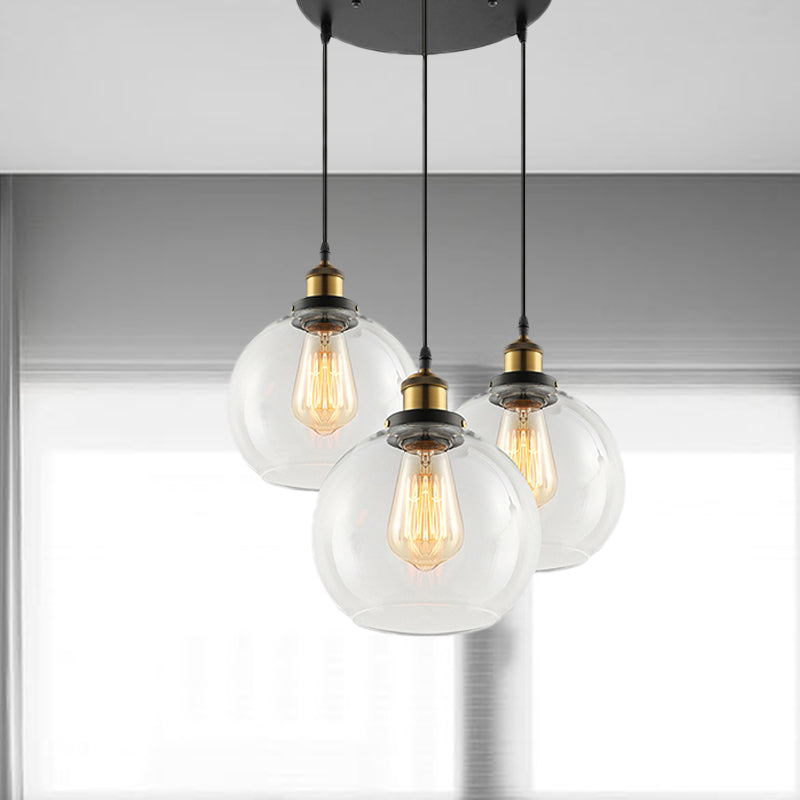 3/4-Light Clear Glass Multi Hanging Light Fixture Industrial Antique Brass Orb Living Room Pendant with Round Canopy Clearhalo 'Ceiling Lights' 'Glass shade' 'Glass' 'Industrial Pendants' 'Industrial' 'Middle Century Pendants' 'Pendant Lights' 'Pendants' 'Tiffany' Lighting' 678258