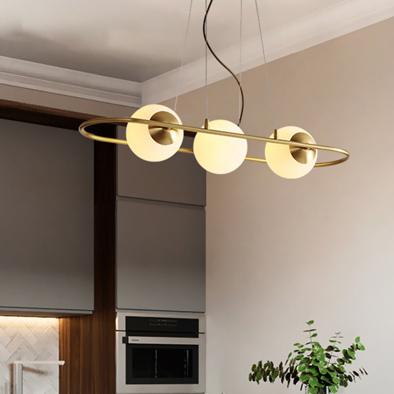 Sphere Dining Room Chandelier Frosted Glass 3-Light Post Modern Hanging Ceiling Lamp with Brass Oval Ring Beam Brass Clearhalo 'Ceiling Lights' 'Chandeliers' 'Modern Chandeliers' 'Modern' Lighting' 735338