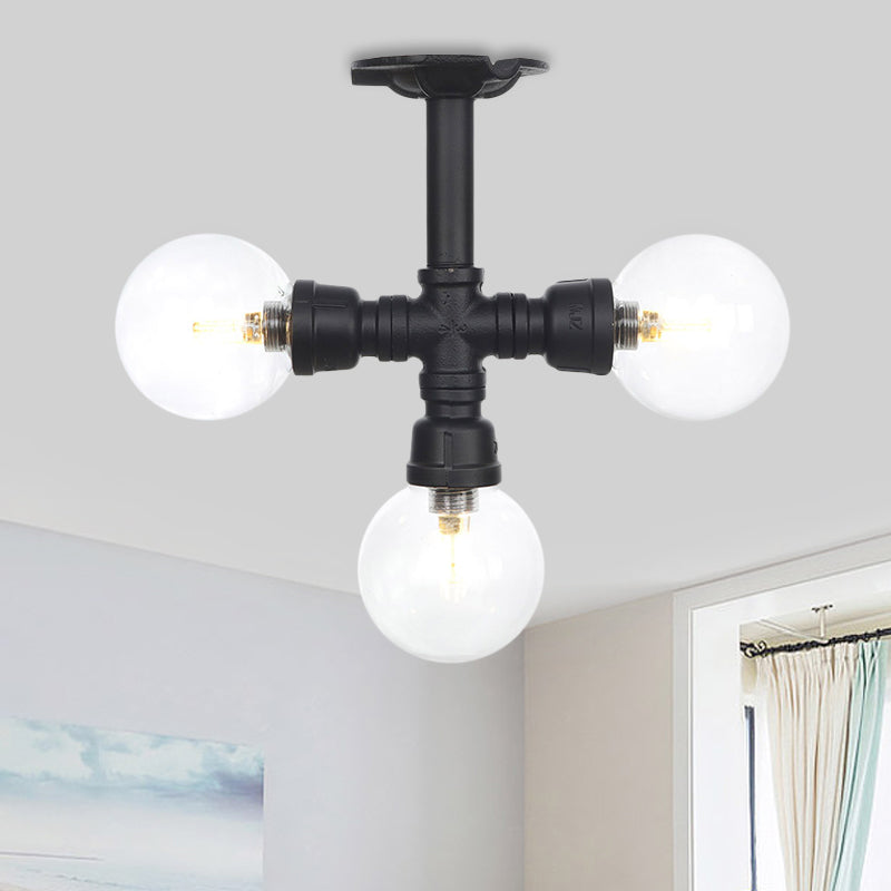 Industrial-Style Orb Semi Flush Light 3/4 Lights Clear Glass LED Flushmount Lamp in Black Black A Clearhalo 'Ceiling Lights' 'Close To Ceiling Lights' 'Close to ceiling' 'Glass shade' 'Glass' 'Semi-flushmount' Lighting' 754119