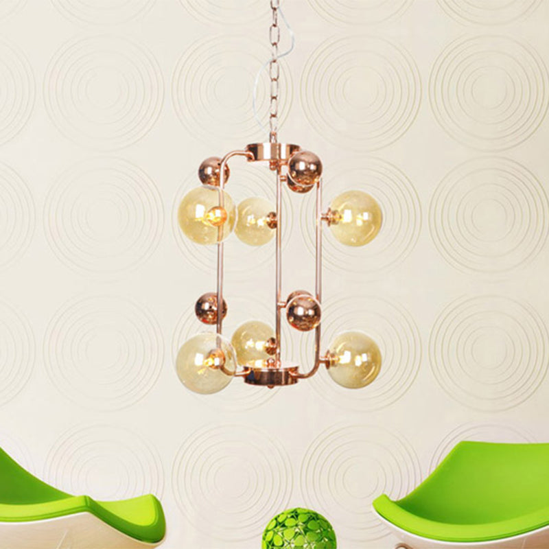 Ball Hanging Chandelier Modernist Smoke Gray/Amber Glass 10-Light Rose Gold Ceiling Suspension Lamp with Frame Amber Clearhalo 'Ceiling Lights' 'Chandeliers' 'Modern Chandeliers' 'Modern' Lighting' 759078