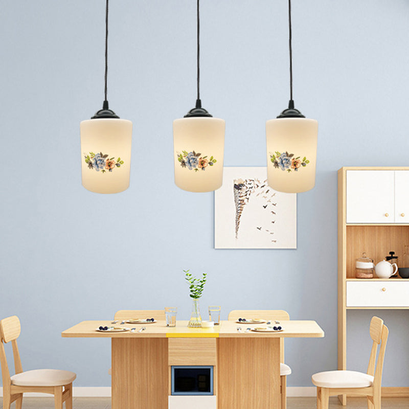 Cylinder Dining Room Multi Ceiling Light Modern White Printed Glass 3-Head Black Hanging Pendant with Linear/Round Canopy Clearhalo 'Ceiling Lights' 'Glass shade' 'Glass' 'Pendant Lights' 'Pendants' Lighting' 802024