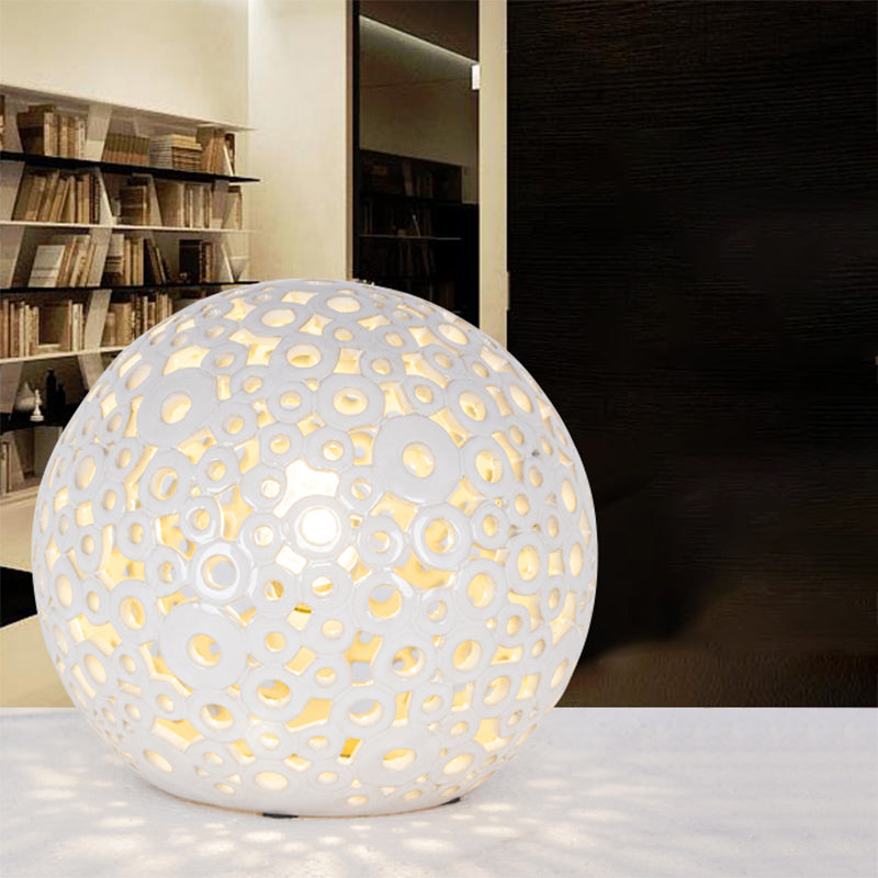 White Hollow-Out Globe Table Light Modernism 1-Head Ceramics Night Lamp for Bedroom White Clearhalo 'Lamps' 'Table Lamps' Lighting' 815356