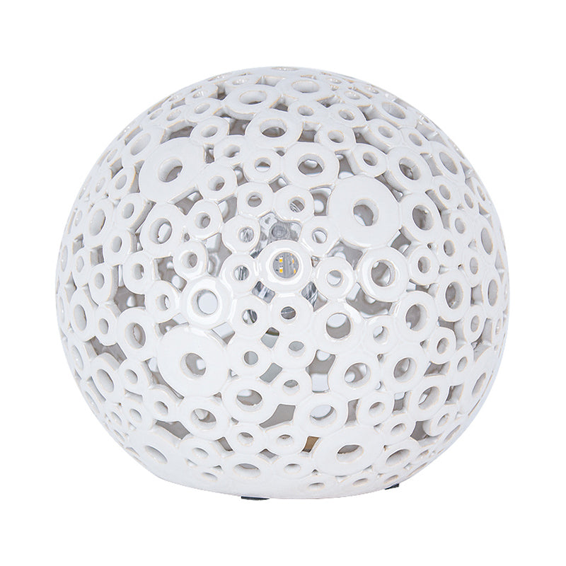 White Hollow-Out Globe Table Light Modernism 1-Head Ceramics Night Lamp for Bedroom Clearhalo 'Lamps' 'Table Lamps' Lighting' 815357