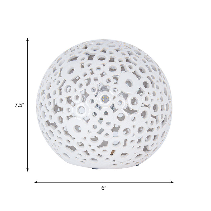 White Hollow-Out Globe Table Light Modernism 1-Head Ceramics Night Lamp for Bedroom Clearhalo 'Lamps' 'Table Lamps' Lighting' 815359