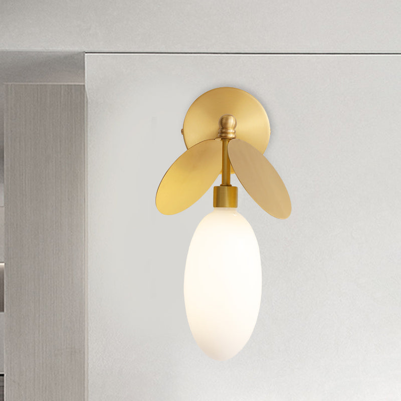 Post Modern Globe/Oval Wall Mount Lamp Cream Glass 1 Light Bedside Wall Light in Brass with Leaf Deco Brass Oval Clearhalo 'Cast Iron' 'Glass' 'Industrial' 'Modern wall lights' 'Modern' 'Tiffany' 'Traditional wall lights' 'Wall Lamps & Sconces' 'Wall Lights' Lighting' 875287