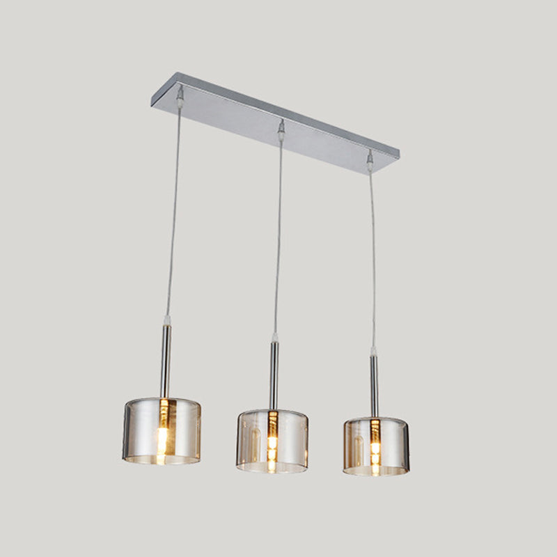 3-Bulb Restaurant Multi-Pendant Modernist Chrome Suspension Light with Drum Clear Glass Shade Clearhalo 'Ceiling Lights' 'Close To Ceiling Lights' 'Glass shade' 'Glass' 'Modern Pendants' 'Modern' 'Pendant Lights' 'Pendants' Lighting' 875480