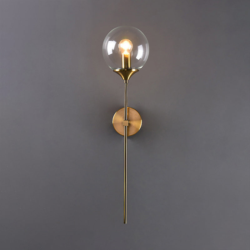 Modern Globe Shade Wall Lighting Single Bulb Clear/Grey/Amber Glass Sconce Light in Brass for Bedroom Clearhalo 'Art deco wall lights' 'Cast Iron' 'Glass' 'Industrial wall lights' 'Industrial' 'Middle century wall lights' 'Modern' 'Rustic wall lights' 'Tiffany' 'Traditional wall lights' 'Wall Lamps & Sconces' 'Wall Lights' Lighting' 968938